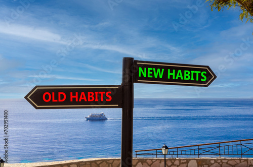 New or old habits symbol. Concept word New habits Old habits on beautiful signpost with two arrows. Beautiful blue sea sky with clouds background. Business new or old habits concept. Copy space.