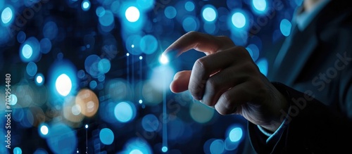 Businessperson dressed in black attire, activating touch button to ensure cloud safety.