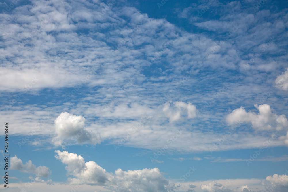 blue cloudy sky background on a summer day blue cloudy sky background on a summer day