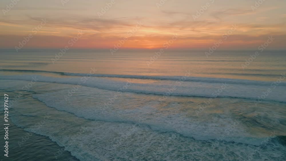 Peaceful ocean evening dusk with golden cloudy sky over endless horizon aerial Peaceful ocean evening dusk with golden cloudy sky over endless horizon aerial