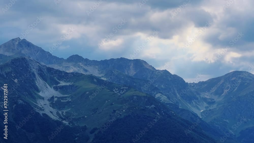 View of the mountain range near Mount Zakan. The top of the mountain node of the western part of the main ridge of the Greater Caucasus. Zakan Peak is the beginning of the Magisho mountain range. 4К View of the mountain range near Mount Zakan. The top of the mountain node of the western part of the main ridge of the Greater Caucasus. Zakan Peak is the beginning of the Magisho mountain range. 4К