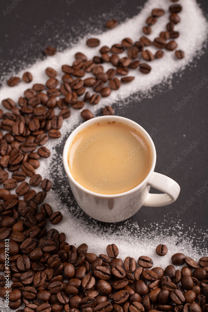 photo a cup of espresso surrounded by aromatic coffee beans, creating a visually pleasing background. With a touch of sugar, it promises a delightful coffee experience captured in this image. photo a cup of espresso surrounded by aromatic coffee beans, creating a visually pleasing background. With a touch of sugar, it promises a delightful coffee experience captured in this image.