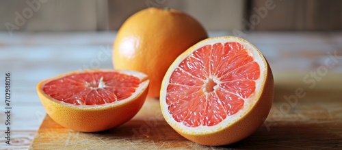 Grapefruit's nutrition details: half grapefruit, low calories, high fiber, vitamins. photo