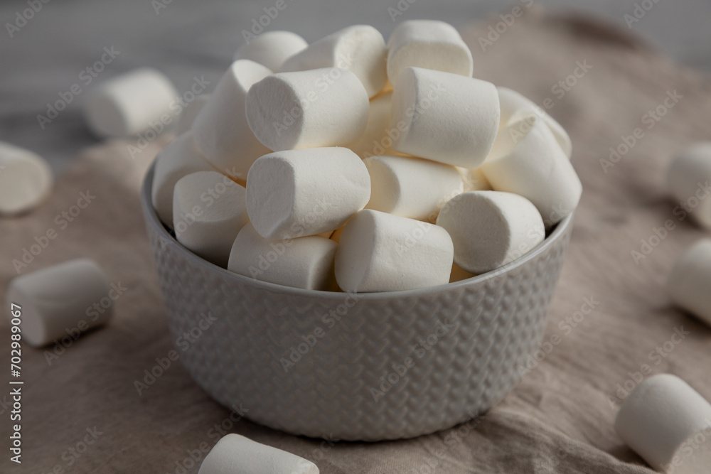 White Marshmallows in a Bowl, side view. Close-up. White Marshmallows in a Bowl, side view. Close-up.