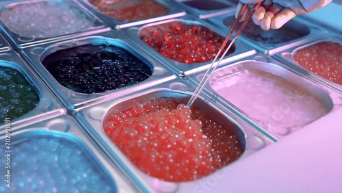 Close up shot of tasty, delicious, sweet boba tea bubbles stired by a spoon