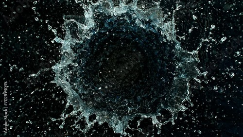 Super Slow Motion Shot of Round Water Splash on Black Background at 1000fps. photo