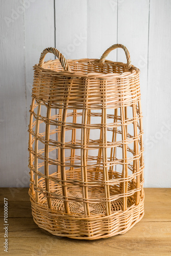 Tall wicker basket with two handles