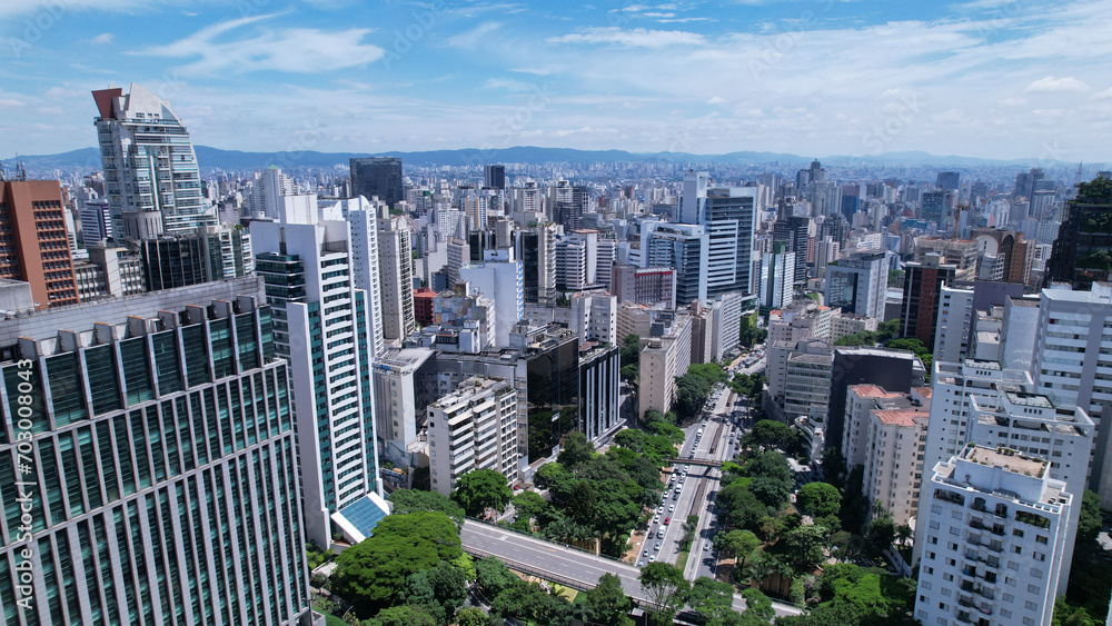 Fototapeta premium Aerial view of Avenida Paulista in Sao Paulo, Brazil. Very famous avenue in the city. High-rise commercial buildings and many residential buildings