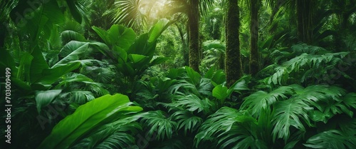 Lush Tropical Foliage Panorama_ A panoramic view of dense tropical foliage  capturing the vibrant 