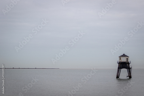 Photography Lighthouse in the sea, Dovercourt low lighthouse at high tide built in 1863 and