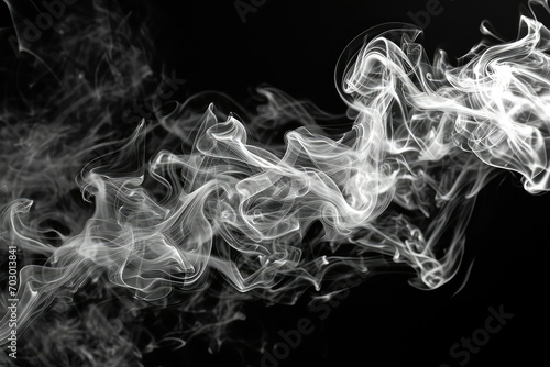 Wisps of white smoke on a black background creating an abstract, ethereal effect perfect for a sense of mystery and intrigue.