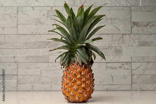 Whole Pineapple Standing Upright On Restaurant Counter, Bokeh Background