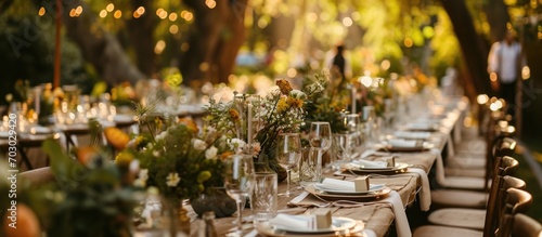 Outdoor tables adorned for a wedding. photo