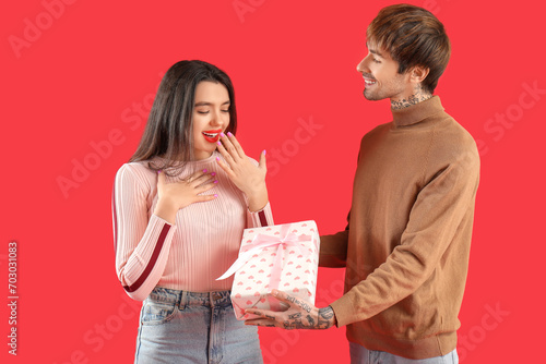 Happy young woman receiving...