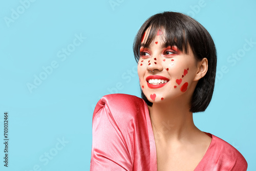 Smiling young woman with he...