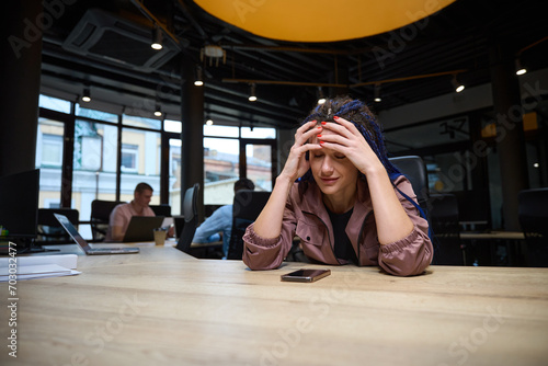 Upset woman looking at smartphone suffering loneliness, break-up with boyfriend © Viacheslav Yakobchuk