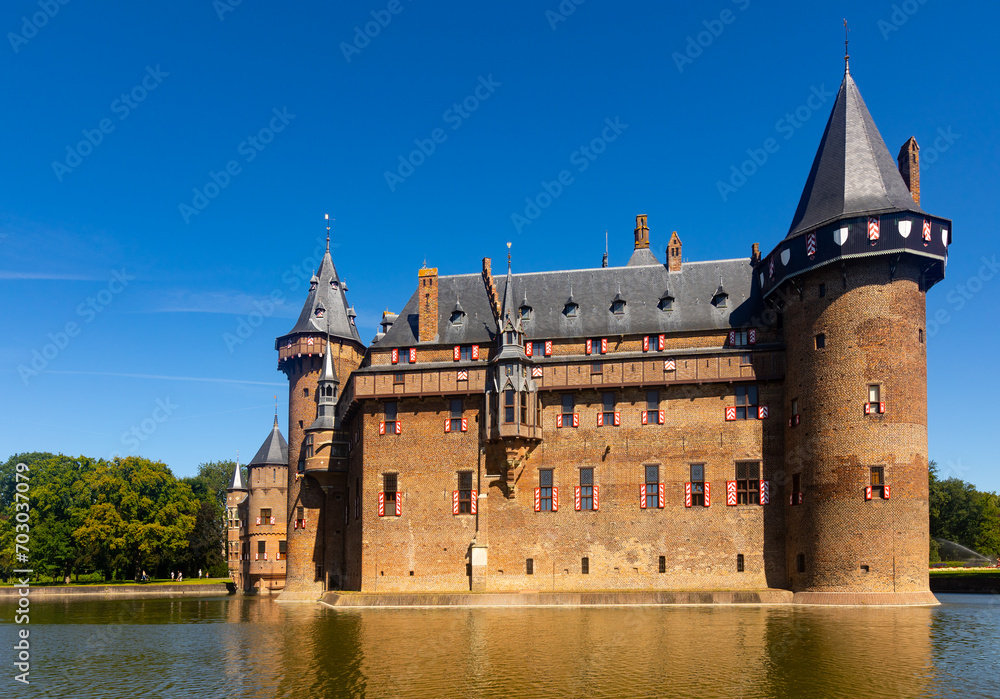 Fototapeta premium Picturesque summer landscape with a view of the ancient Castle De Haar, located near the city of Utrecht, Netherlands