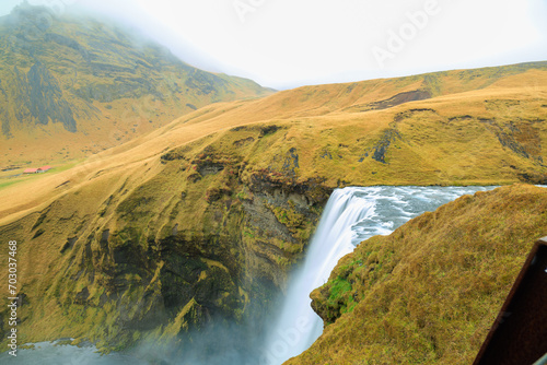waterfall in the mountains; view of the Skógafoss waterfall from the top of the viewing platform
