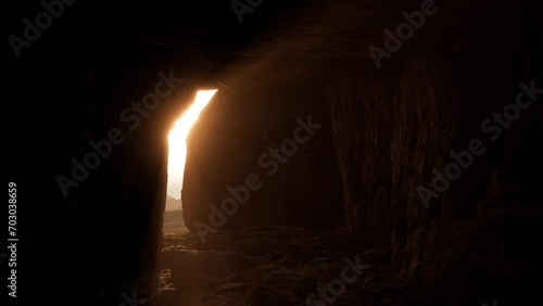 A stone opening a dark tomb and showing a holy cross on the horizon. Easter background  photo