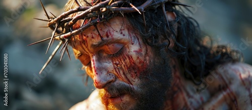 Jesus Christ with thorns on his head during crucifixion. photo