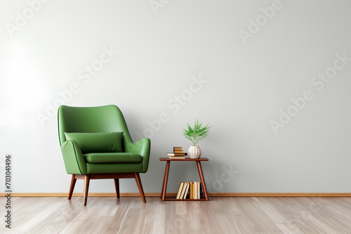 In a modern interior, a white-walled space boasts a wooden floor, an accent chair with a green cushion, and scattered books artfully arranged on the floor.