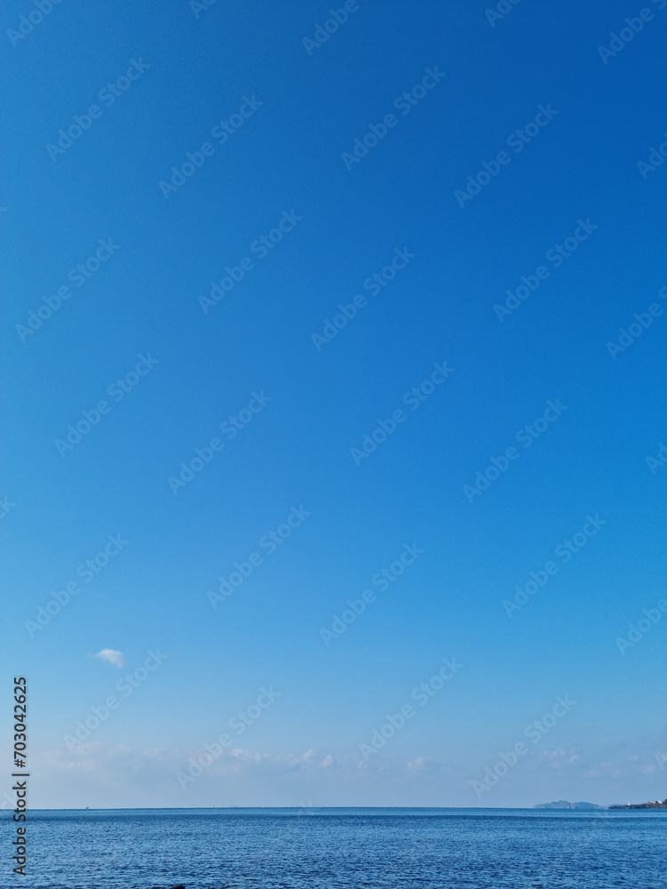 Fototapeta premium Blue gradient sky with blue sea view