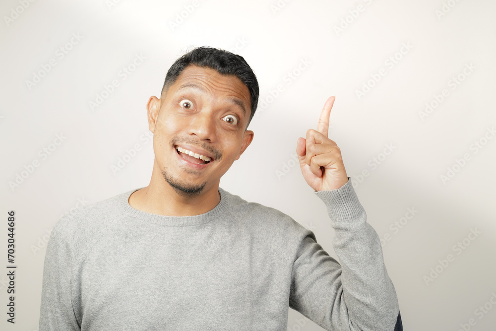 surprised, shocked expression of Asian Man with hand point, isolated background surprised, shocked expression of Asian Man with hand point, isolated background