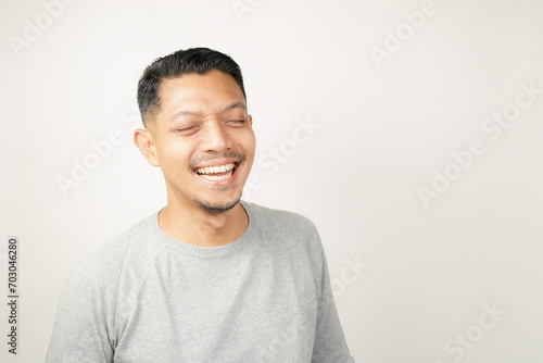 Asian man expression with happy laughing face, isolated background