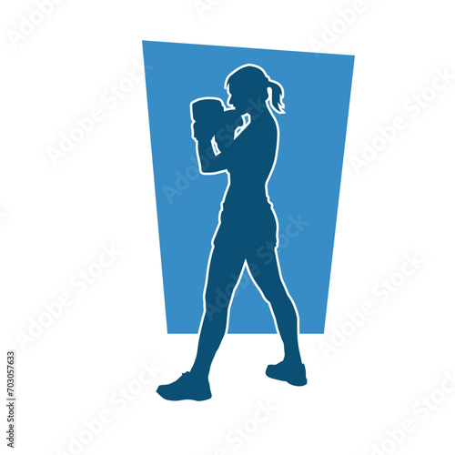 Silhouette of woman boxing athlete in action pose. Silhouette of a female wearing boxing gloves for boxing sport.