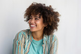 The Happy African American Lady with a Stylish Afro: Confident, Smiling, and Expressive against a Cool White Wall