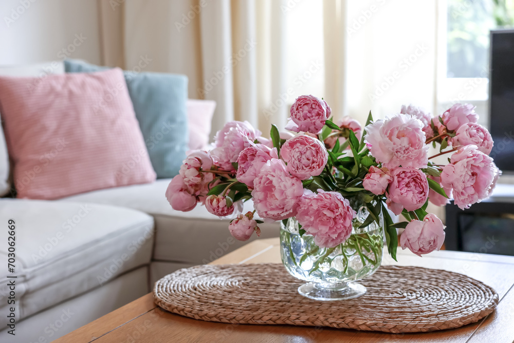 Beautiful pink peonies in vase on table at home, space for text. Interior design - obrazy, fototapety, plakaty 