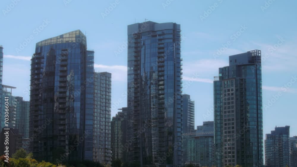 Glass facade buildings of the downtown Vancouver, Canada. Slow motion. Glass facade buildings of the downtown Vancouver, Canada. Slow motion.
