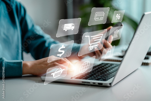 Women use a laptop with a shopping cart and diagram business icon, online e-commerce marketing concept, shopping service on the online platform and home delivery, online business, modern lifestyle. photo