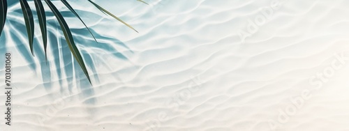 palm leaf shadow on abstract white sand beach background  sun lights at water surface  beautiful abstract background concept banner for summer and vacation at the beach