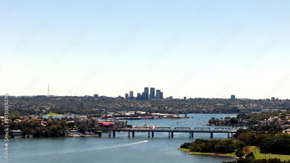 Harbor Vista: Breathtaking View of a Bustling Cityscape Beyond the Calm Blue Waters Harbor Vista: Breathtaking View of a Bustling Cityscape Beyond the Calm Blue Waters