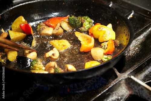 frying pan with meat and vegetables