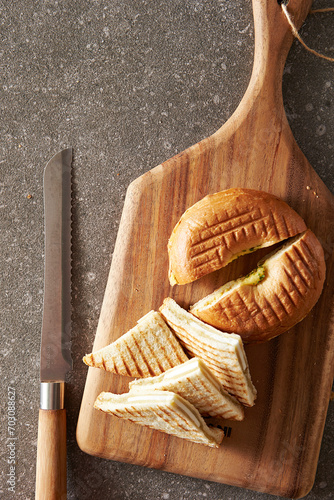 Bagels and kaya toast on cutting board photo
