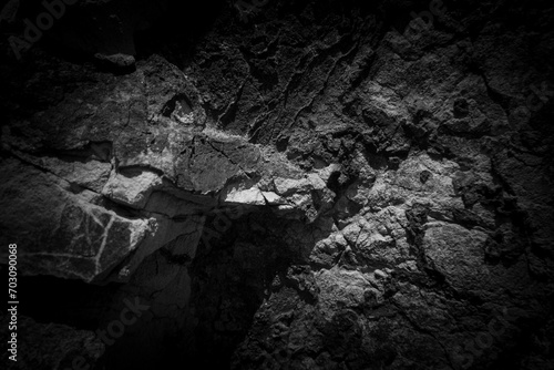 Weathered stone background. Black and white rock surface texture. photo
