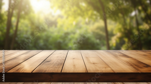 A rustic wooden deck provides a natural viewing platform over a serene, sunlit forest with lush green foliage.