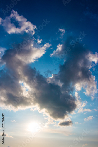 Ring shaped cloud on blue sky, vertical view