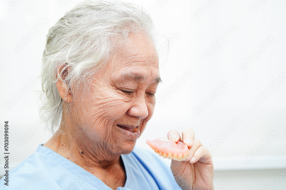 Doctor holding teeth denture in hand for dentist studying about dentistry. Doctor holding teeth denture in hand for dentist studying about dentistry.