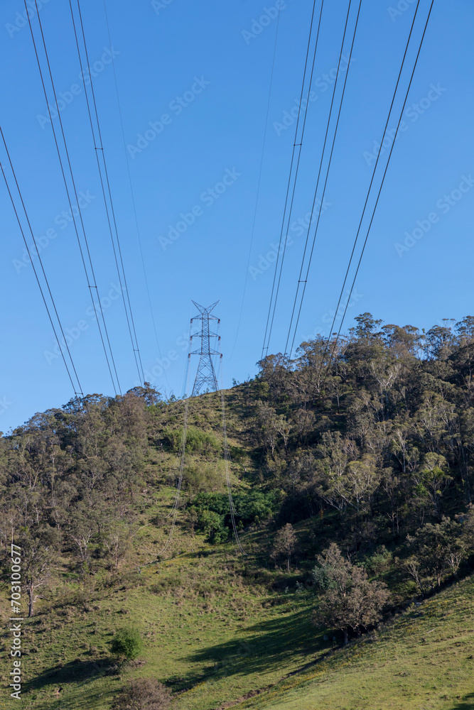Photograph of a large telecommunications tower located on a green and grassy hill in the Blue Mountains in regional Australia Photograph of a large telecommunications tower located on a green and grassy hill in the Blue Mountains in regional Australia
