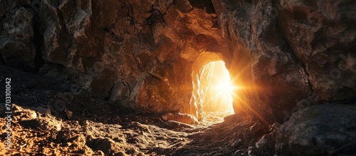 Jesus' tomb emitting light from an opening. photo