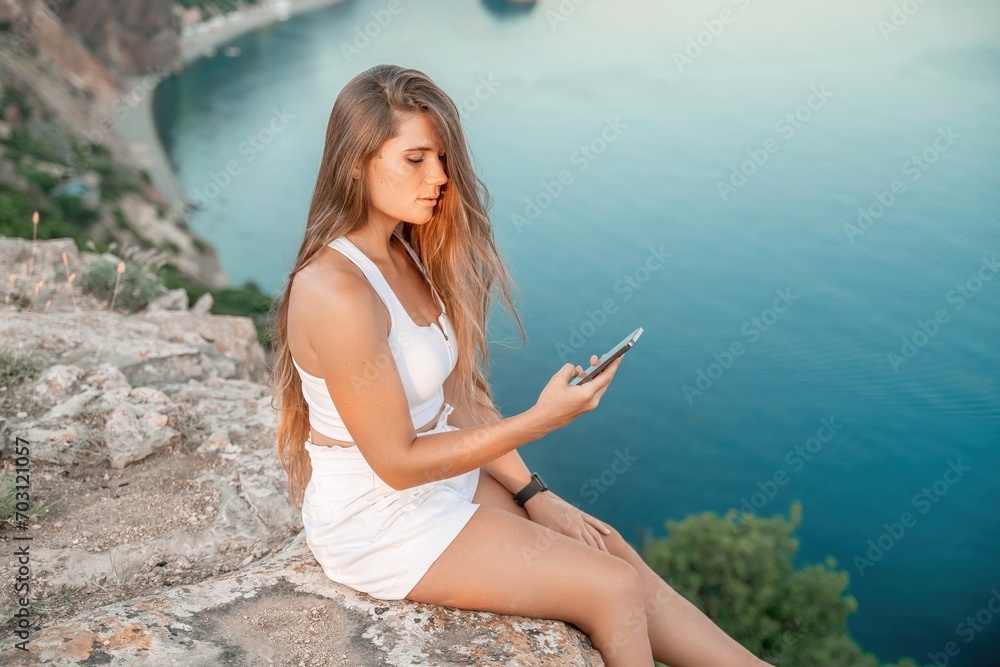 Portrait of a happy woman with long hair against the sea Portrait of a happy woman with long hair against the sea