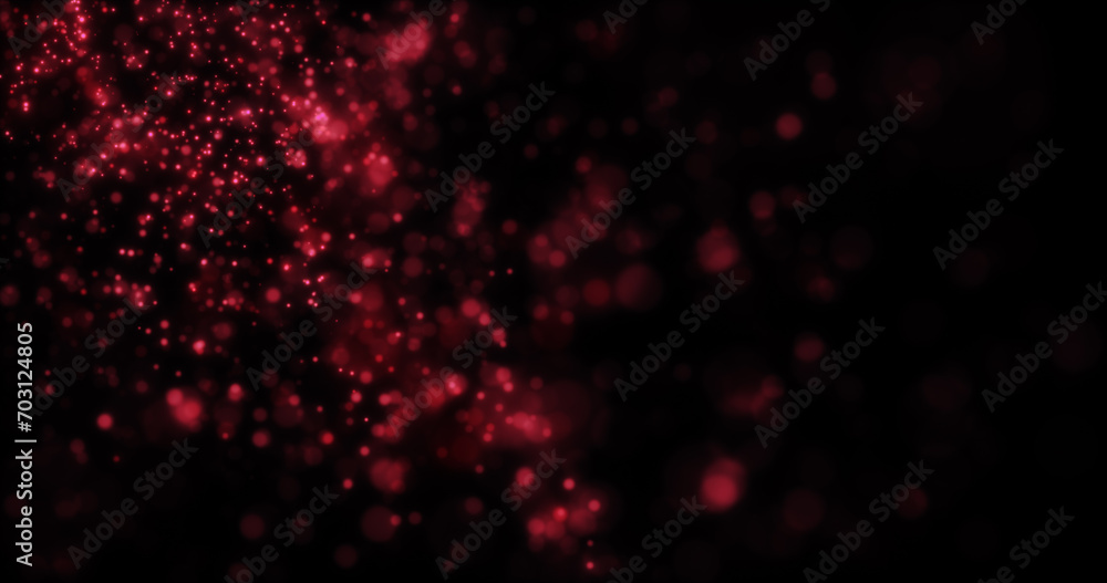 Blurred red abstract background of bokeh and small round particles of energy magical holiday flying dots on a black background Blurred red abstract background of bokeh and small round particles of energy magical holiday flying dots on a black background