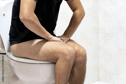 Sitting on toilet with suffering from constipation or hemorrhoid.  Feels uncomfortable in his stomach and is constipated in the toilet. suffering from diarrhea  cystitis. Stomach pain during PMS.