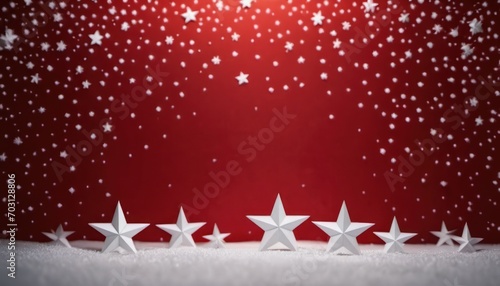  a group of five white stars sitting on top of a snow covered ground in front of a red background with snow flecked stars in the middle of the foreground.