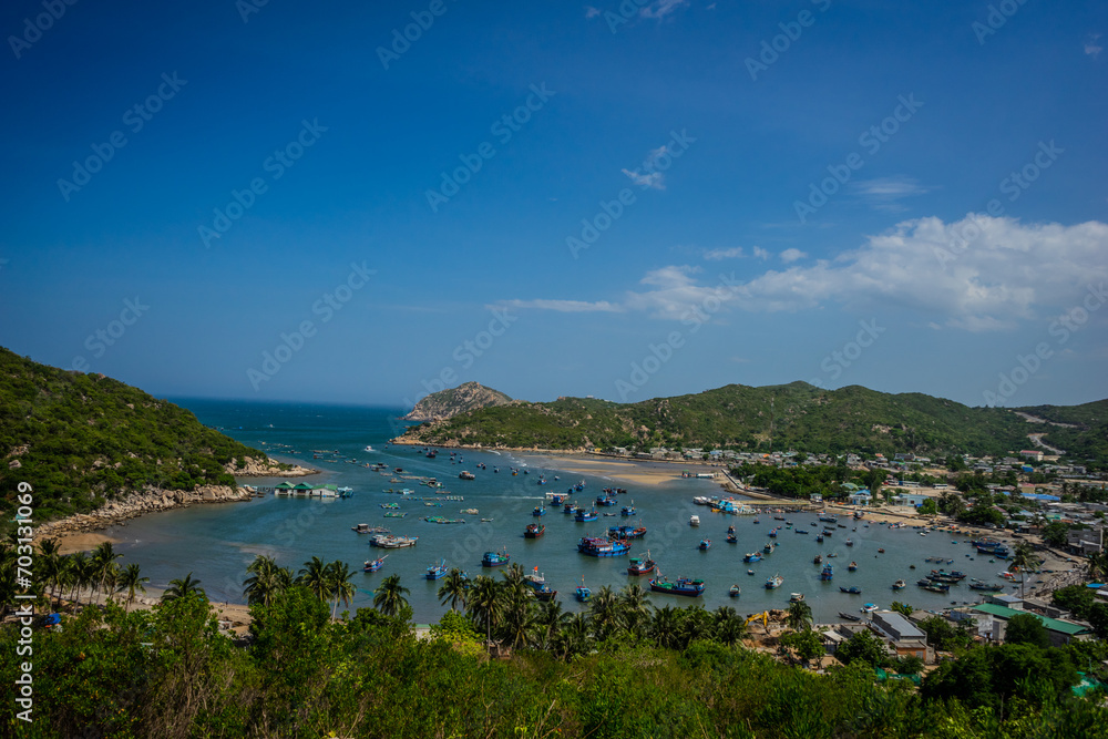 Vinh Hy Bay is a famous solo traveler in Phan Rang, Ninh Thuan. In the bay, there are many old fishermen's boats parked.
