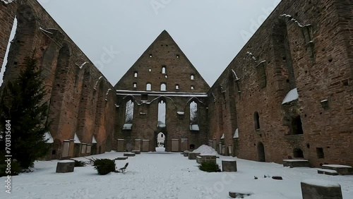 Pirita Convet Ruins in Tallinn Estonia. Historical Architecture of the Pirita Convent. Winter Time Snowy Day. St. Bridget's Convent Ruins Medieval Monastery, Slow Motion Stedycam Shot photo