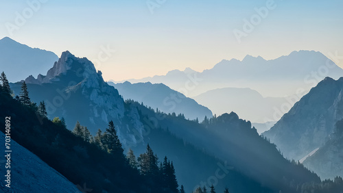 Scenic view of mountain peak Grintovec in majestic Kamnik-Savinja Alps, Slovenia, Europe. Magnificent Hiking trail on Loibl Pass in untamed Karawanks, Austrian border. Magical mountains Slovenian Alps photo